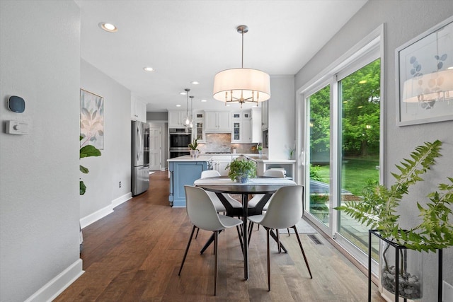 9848 N Lamplighter Ln, Mequon, WI 53092 - dining room featuring dark wood-style floors, a chandelier, and recessed lighting