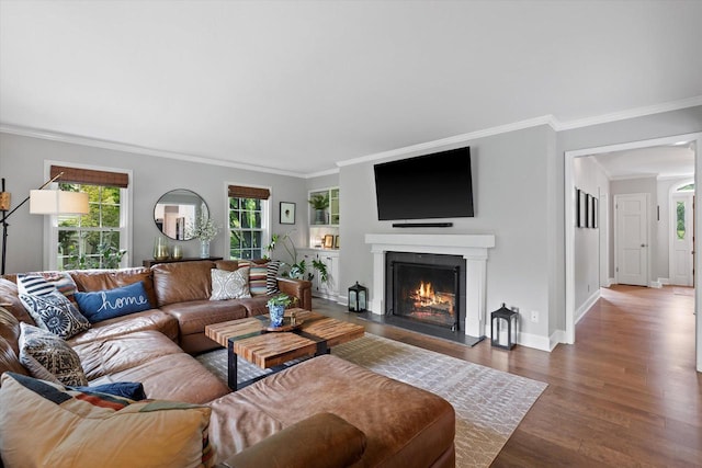 9848 N Lamplighter Ln, Mequon, WI 53092 - living room with a warm lit fireplace, wood finished floors, and ornamental molding