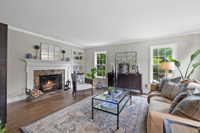 9848 N Lamplighter Ln, Mequon, WI 53092 - living room featuring plenty of natural light, wood finished floors, ornamental molding, a tiled fireplace, and built in shelves