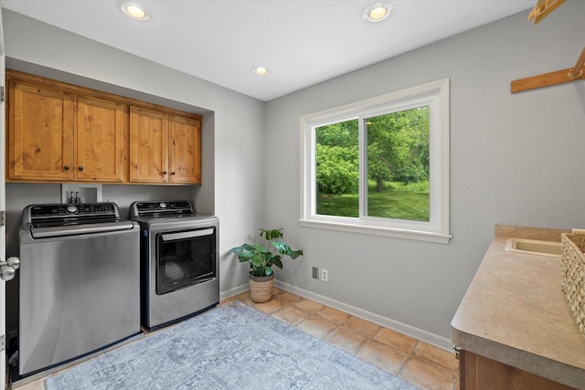 9848 N Lamplighter Ln, Mequon, WI 53092 - laundry room featuring cabinet space, washing machine and dryer, recessed lighting, and light tile patterned floors