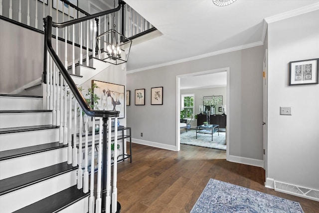 9848 N Lamplighter Ln, Mequon, WI 53092 - staircase with ornamental molding and wood finished floors
