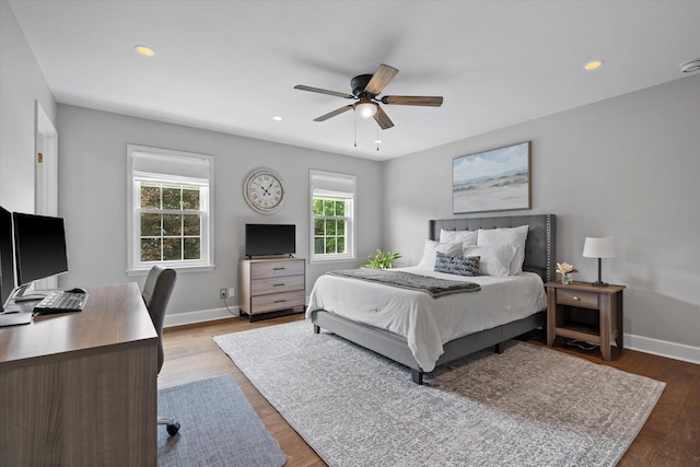 9848 N Lamplighter Ln, Mequon, WI 53092 - bedroom with an office area, wood finished floors, recessed lighting, and ceiling fan