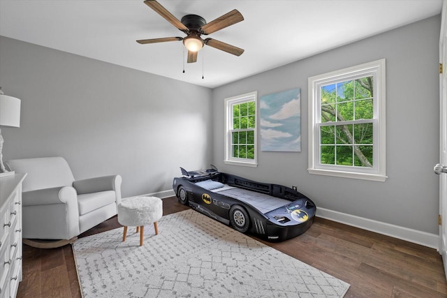 9848 N Lamplighter Ln, Mequon, WI 53092 - bedroom featuring dark wood-style flooring and a ceiling fan