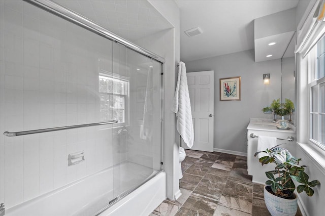 9848 N Lamplighter Ln, Mequon, WI 53092 - bathroom with vanity and shower / bath combination with glass door