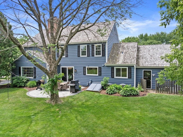 9848 N Lamplighter Ln, Mequon, WI 53092 - rear view of property featuring a chimney, a patio, and an outdoor hangout area