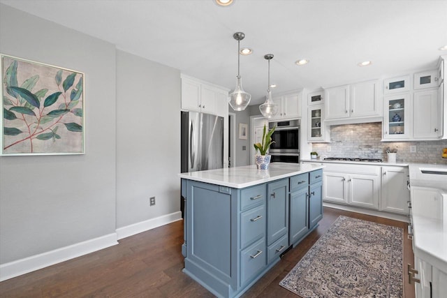 9848 N Lamplighter Ln, Mequon, WI 53092 - kitchen featuring white cabinetry, stainless steel appliances, light countertops, backsplash, and recessed lighting