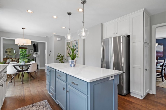 9848 N Lamplighter Ln, Mequon, WI 53092 - kitchen with freestanding refrigerator, dark wood-style floors, recessed lighting, white cabinetry, and blue cabinets