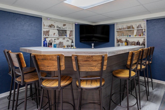 1119 W Grand Ave, Rothschild, WI 54474 - indoor bar with wood finished floors, built in features, and a drop ceiling