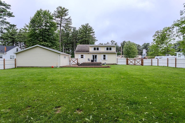 1119 W Grand Ave, Rothschild, WI 54474 - rear view of house with a deck and a fenced backyard