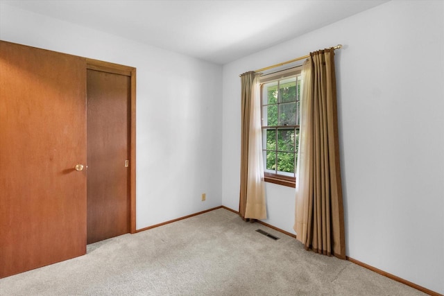 W173N8465 Robert Ave, Menomonee Falls, WI 53051 - unfurnished room featuring light carpet and baseboards
