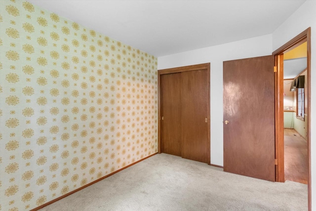 W173N8465 Robert Ave, Menomonee Falls, WI 53051 - unfurnished bedroom with wallpapered walls, multiple closets, and carpet