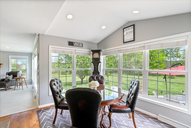 110985 Candlewood Ct, Marshfield, WI 54449 - dining room featuring recessed lighting, a baseboard heating unit, dark wood-type flooring, and lofted ceiling