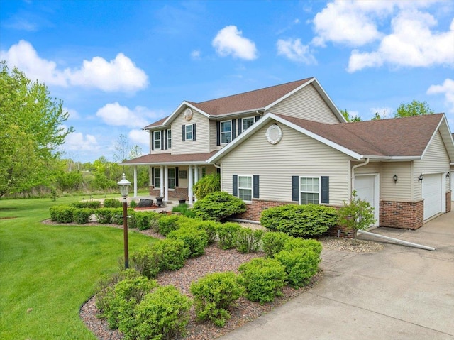 110985 Candlewood Ct, Marshfield, WI 54449 - view of front of property with brick siding, a porch, a garage, and a front lawn