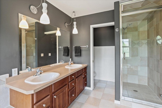 110985 Candlewood Ct, Marshfield, WI 54449 - bathroom featuring a shower stall, double vanity, and tile patterned flooring