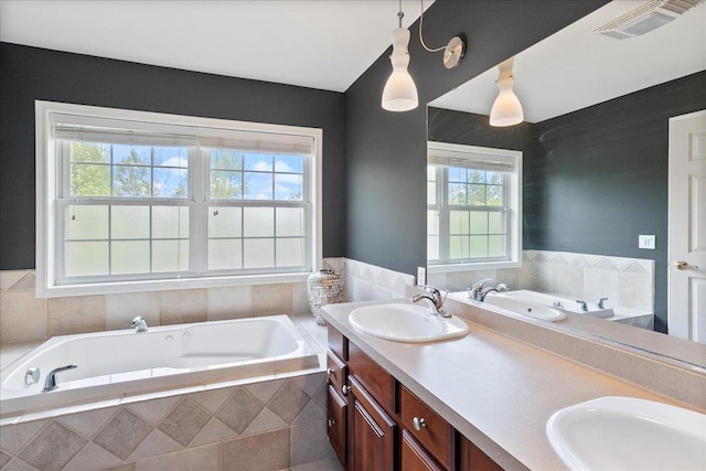 110985 Candlewood Ct, Marshfield, WI 54449 - bathroom featuring healthy amount of natural light, a tub with jets, and double vanity