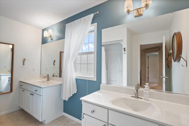 110985 Candlewood Ct, Marshfield, WI 54449 - full bathroom with two vanities and baseboards