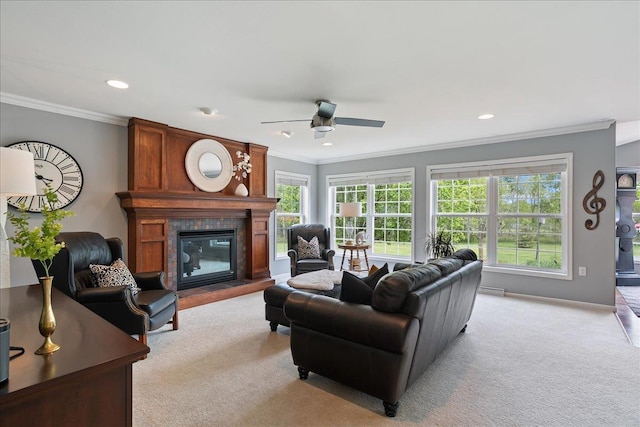 110985 Candlewood Ct, Marshfield, WI 54449 - living room featuring light colored carpet, a ceiling fan, a fireplace, ornamental molding, and recessed lighting