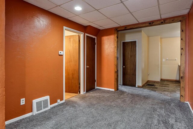 1015 Bluff St, Beloit, WI 53511 - carpeted spare room with a drop ceiling and a textured wall