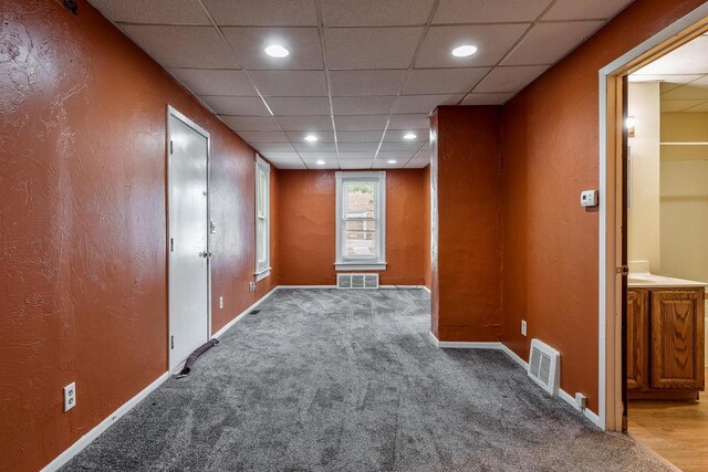 1015 Bluff St, Beloit, WI 53511 - carpeted empty room featuring a drop ceiling and recessed lighting