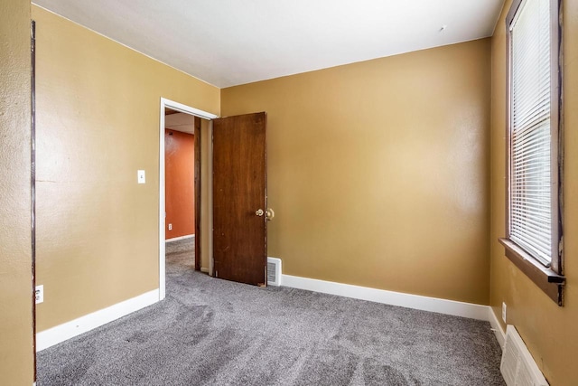 1015 Bluff St, Beloit, WI 53511 - carpeted spare room featuring baseboards
