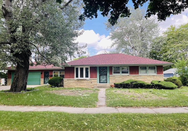 5734 N 80th St, Milwaukee, WI 53218 - ranch-style home with an attached garage, stone siding, and a front lawn