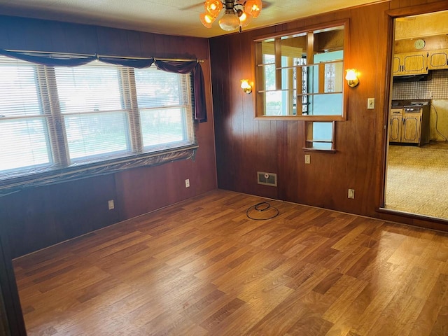 5734 N 80th St, Milwaukee, WI 53218 - empty room featuring wood finished floors and wood walls