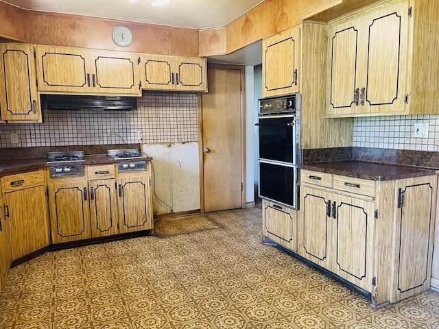 5734 N 80th St, Milwaukee, WI 53218 - kitchen with exhaust hood, dark countertops, and tasteful backsplash
