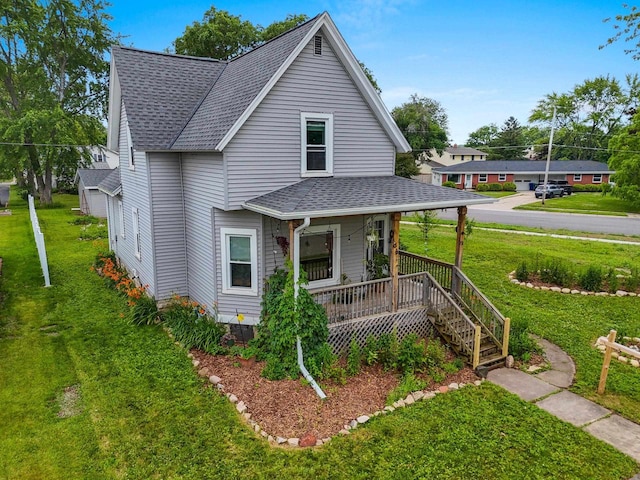 731 S Michigan St, De Pere, WI 54115 - view of front of home with a shingled roof, a porch, and a front yard