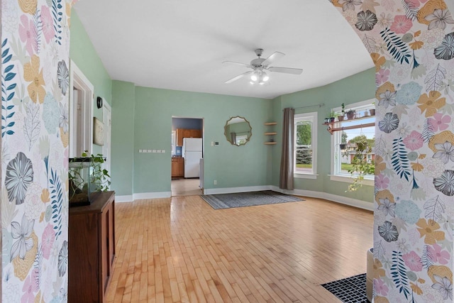 731 S Michigan St, De Pere, WI 54115 - entryway with light wood-type flooring, a ceiling fan, and arched walkways