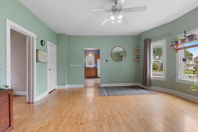 731 S Michigan St, De Pere, WI 54115 - spare room with light wood-style flooring and ceiling fan