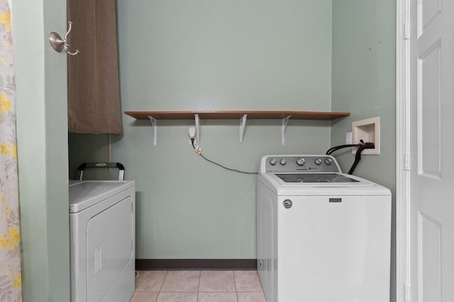 731 S Michigan St, De Pere, WI 54115 - washroom featuring washer and dryer and light tile patterned floors