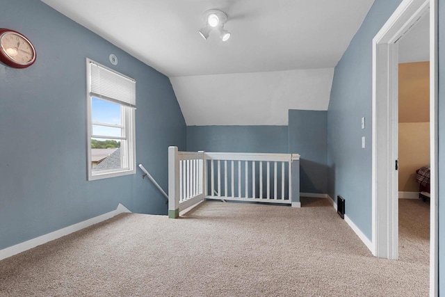 731 S Michigan St, De Pere, WI 54115 - additional living space with carpet and vaulted ceiling