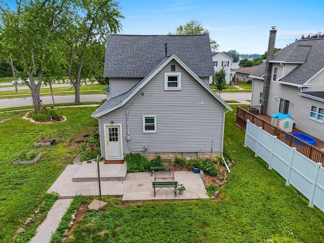 731 S Michigan St, De Pere, WI 54115 - back of house featuring a patio area and a shingled roof