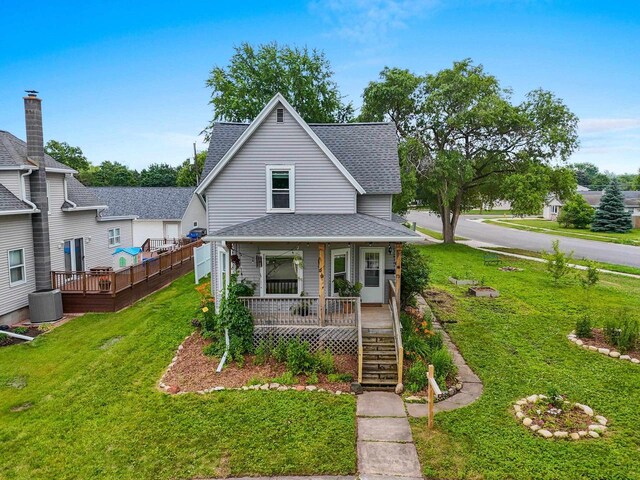 731 S Michigan St, De Pere, WI 54115 - view of front of house with a shingled roof, a porch, a front yard, and stairs