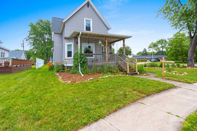 731 S Michigan St, De Pere, WI 54115 - view of front of property with a porch and a front lawn