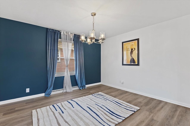 8122 W Potomac Ave, Milwaukee, WI 53218 - spare room with a chandelier and wood finished floors