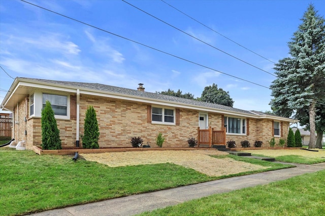 8122 W Potomac Ave, Milwaukee, WI 53218 - ranch-style house featuring a front yard, brick siding, and a shingled roof