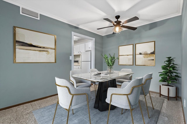 2300 W Good Hope Rd Unit 242, Glendale, WI 53209 - dining area featuring carpet, a ceiling fan, and ornamental molding