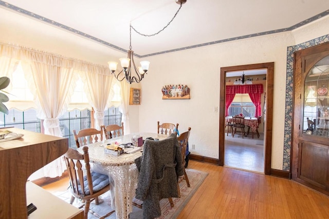 7414 5th Ave, Kenosha, WI 53143 - dining space featuring a chandelier and light wood finished floors