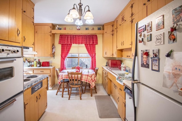 7414 5th Ave, Kenosha, WI 53143 - kitchen featuring white appliances, a chandelier, extractor fan, light countertops, and light flooring
