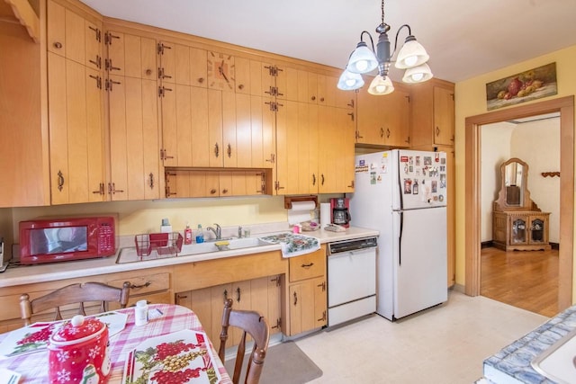 7414 5th Ave, Kenosha, WI 53143 - kitchen with white appliances, light countertops, light flooring, and a chandelier