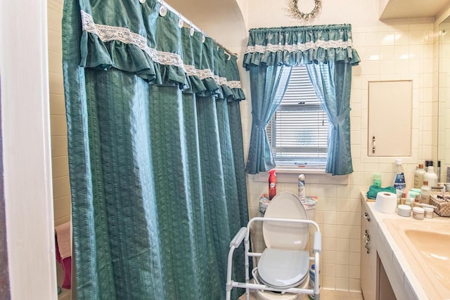 7414 5th Ave, Kenosha, WI 53143 - bathroom featuring tile walls, vanity, and tile patterned flooring