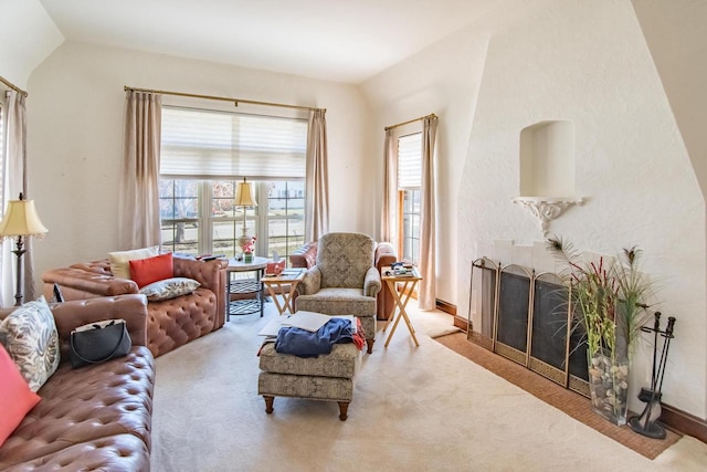 7414 5th Ave, Kenosha, WI 53143 - living room with plenty of natural light, carpet, lofted ceiling, and a fireplace with flush hearth