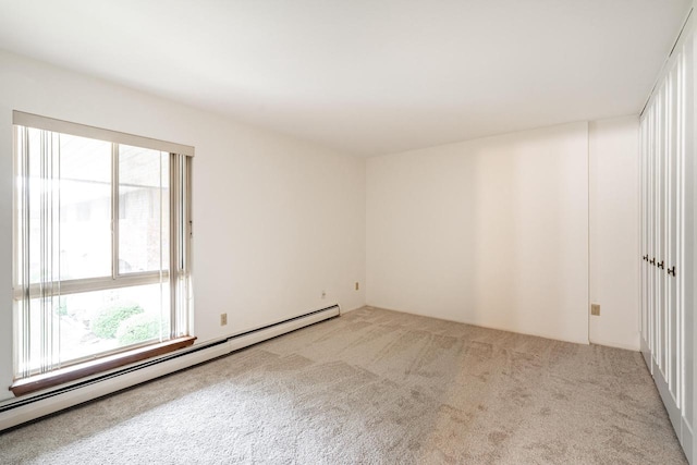 11957 N Appleton Ave Unit 19, Milwaukee, WI 53224 - unfurnished room with baseboard heating, plenty of natural light, and carpet floors