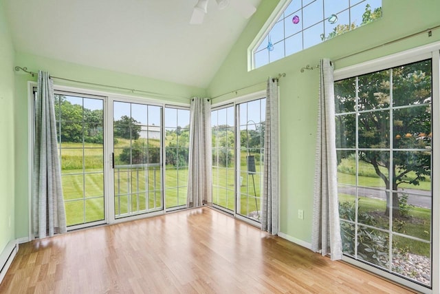 5682 Steeplechase Dr, Waunakee, WI 53597 - unfurnished sunroom featuring high vaulted ceiling, wood finished floors, and a baseboard heating unit