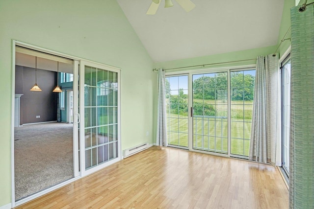 5682 Steeplechase Dr, Waunakee, WI 53597 - unfurnished sunroom with a baseboard heating unit, lofted ceiling, and plenty of natural light
