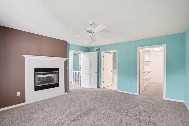 5682 Steeplechase Dr, Waunakee, WI 53597 - unfurnished bedroom featuring a fireplace, carpet, ceiling fan, and connected bathroom