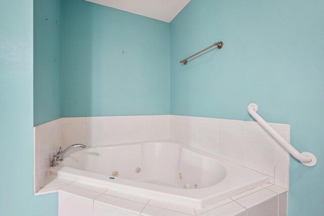 5682 Steeplechase Dr, Waunakee, WI 53597 - full bathroom with a whirlpool tub