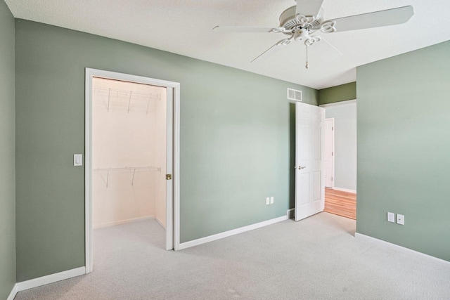 5682 Steeplechase Dr, Waunakee, WI 53597 - unfurnished bedroom with carpet, a ceiling fan, a closet, and a spacious closet