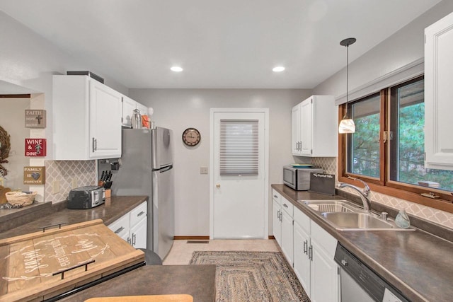 1167 Tee Trl, Nekoosa, WI 54457 - kitchen with dark countertops, white cabinetry, stainless steel appliances, tasteful backsplash, and recessed lighting